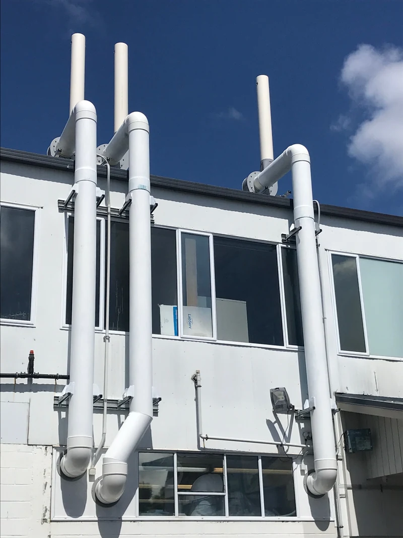 Outside discharge stacks for a ducted extraction system