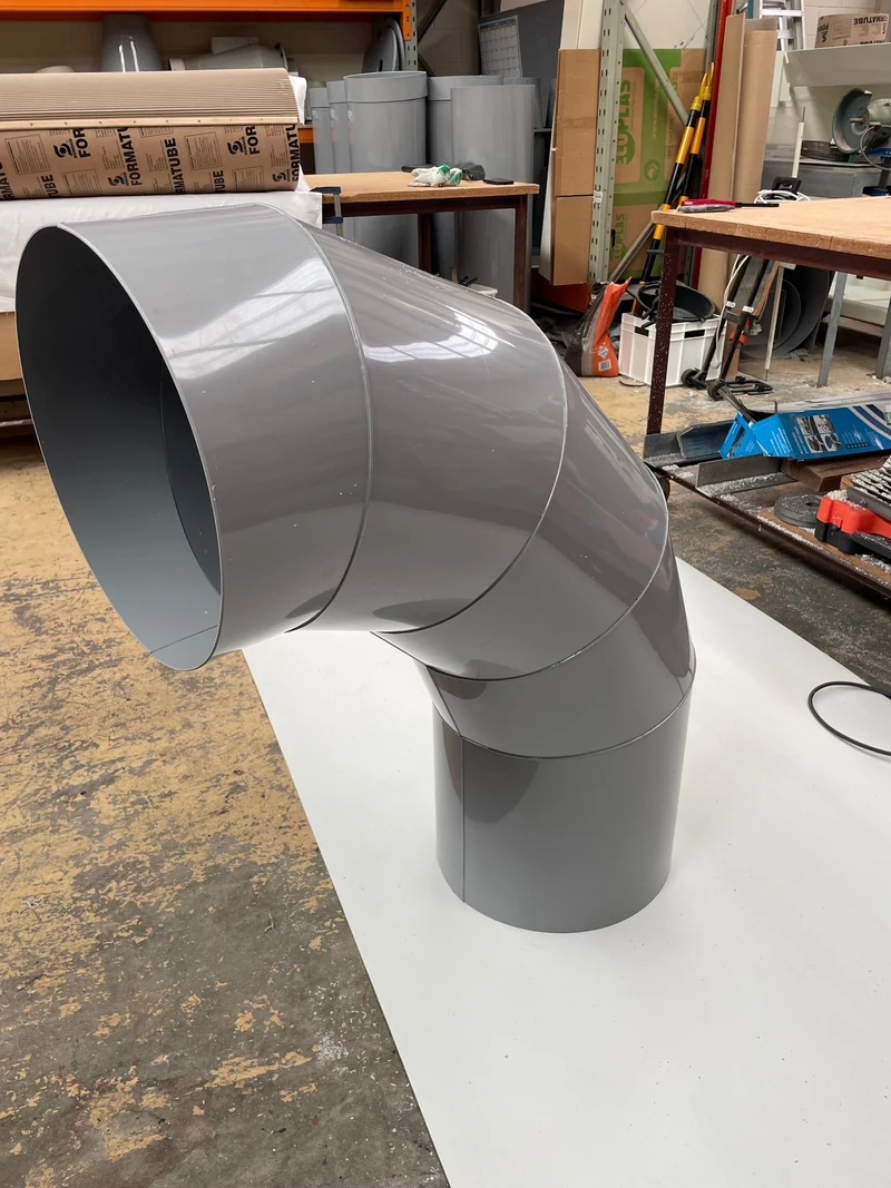 Fabricated PVC component for an extraction duct route